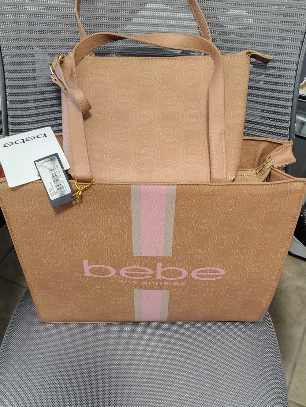 Brand New Bebe Pink and Tan Tote with Signature Stripe And Extra Wristlet